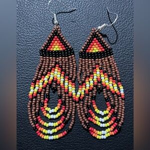 Brown, black, red orange, yellow and white fringe earrings